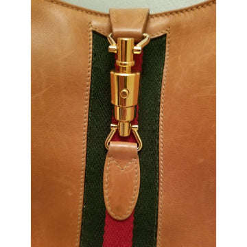 Rare, vintage, Gucci, camel leather 1961 Jackie hobo shoulder bag with a red & green center stripe, gold piston closure, & extender strap