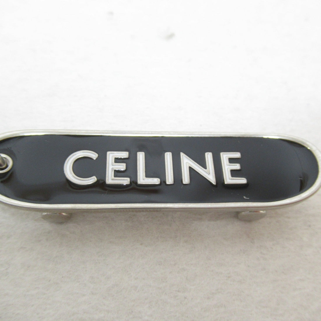 Celine skateboard charm Black White Plastic enamel 49I986BRE 38AW
