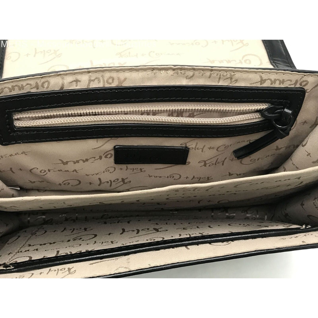 Foley & Corina, black leather, crossbody purse with an envelope top, a back zip pocket and lots of interior pockets.