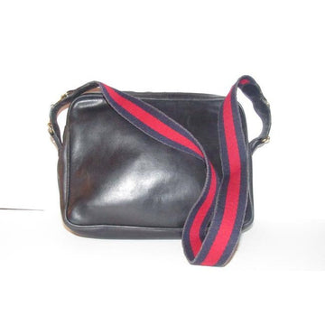 SALE! Vintage, Gucci, navy leather, shoulder bag with a zip top closure, front pocket, and a red and navy striped strap with gold horse-bit accents