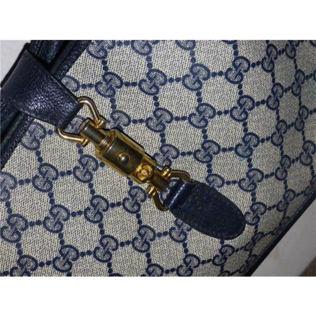Mod, Gucci, 1961 Jackie- O style, dark blue Guccissima print coated canvas and navy leather, shoulder bag with gold piston closure and strap extender