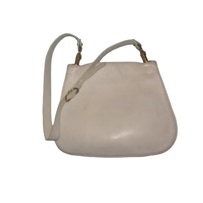 Vintage 1970s Gucci white textured leather Blondie style saddle bag with XL gold GG logo cutout in mint condition