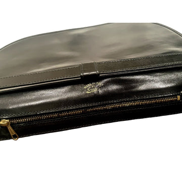 Vintage, rare, black leather, Gucci shoulder bag with a large, two-tone 'GG' emblem and removable strap