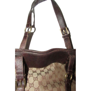 Gucci brown Guccissima print canvas & leather strappy cylindrical tote with brass accents