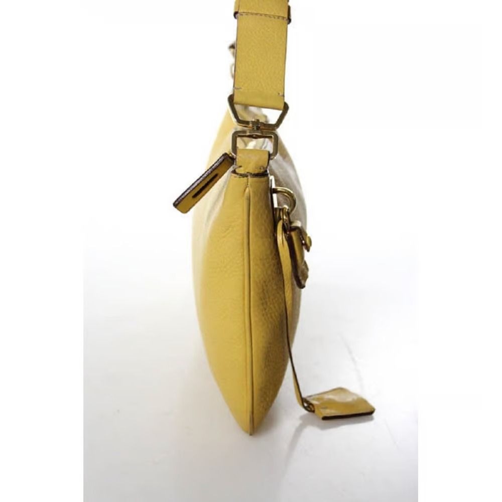 Vintage 90s Prada, yellow grained leather, hobo-style satchel with top zip, gold hardware, & padlock/keys