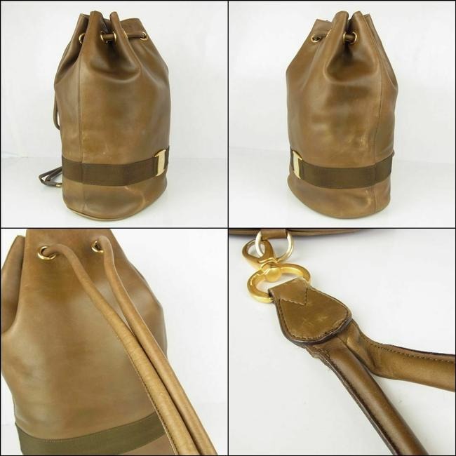 Amazing, Salvatore Ferragamo, RARE, olive green leather XL bucket bag or backpack with a gold Vara accent and a drawstring top closure