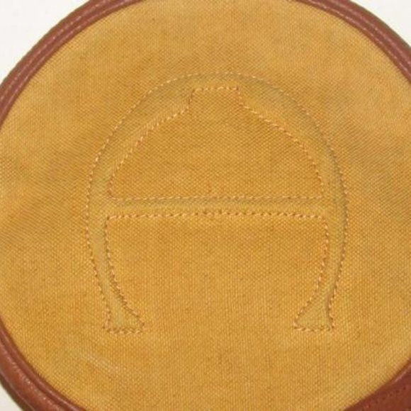 Etienne Aigner, 1970's- 1980's, yellow canvas and brown leather round canteen style cross body or shoulder bag