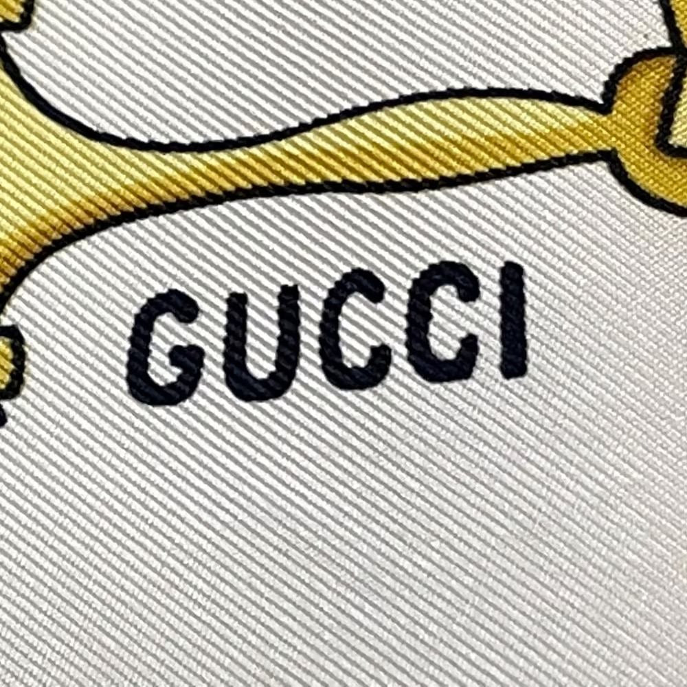 Vintage, Gucci, equestrian print, 35" square, 100 % silk scarf in brown, gold, & black on a white background with a wide brown border