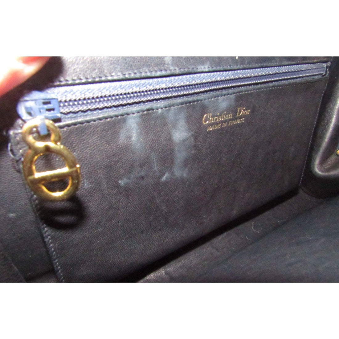 1960s mod, Dior, navy blue leather, two-way style with a hinged top with a latch snap closure, bold, gold Dior accents, & a removable strap