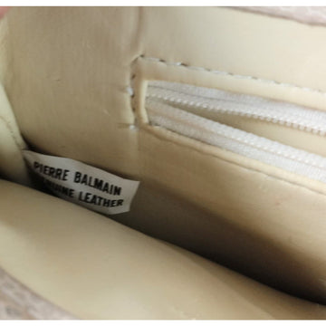 1980s, Balmain, off white/ivory leather, shoulder bag with a twist clasp on the envelope flap, multiple compartments, all of its paper work