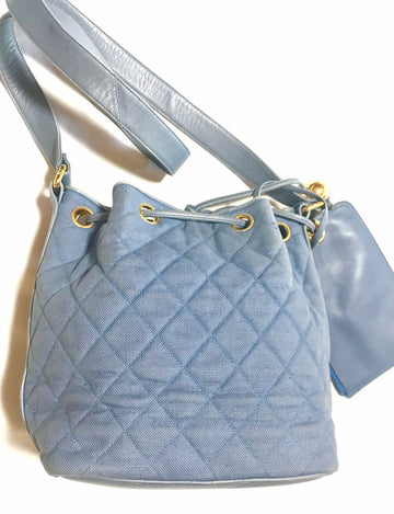 Chanel Vintage blue quilted canvas and leather combo hobo bucket shoulder Bag with drawstrings and golden CC mark balls