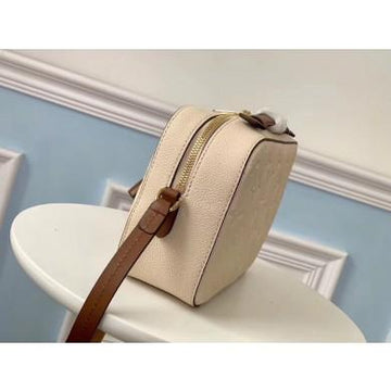 Louis Vuitton Saintonge Monogram Empreinte Leather Creme Caramel